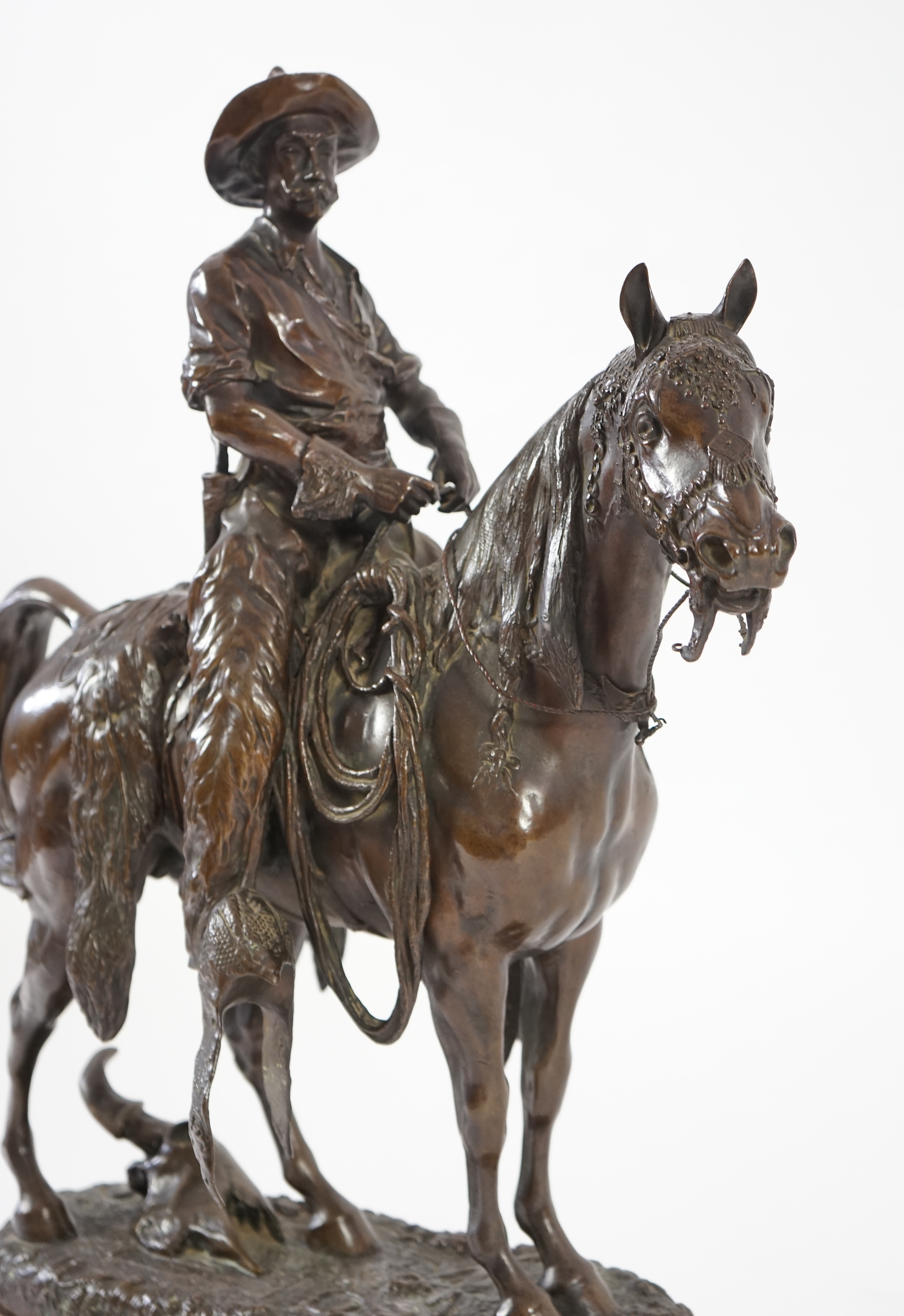 Walter Winans (St. Petersburg, 1852-Parsloe Park, Essex, 1920), a cast bronze of the artist, as a cowboy, riding the Arab stallion Skowronek, 50cm wide, 66cm high, overall 79.5cm high